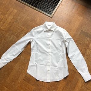 Women’s white tailored button up shirt
